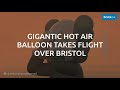 Artist KAWS GIGANTIC hot air balloon flies over Bristol