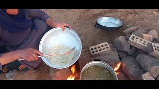 Cooking local food by a village woman