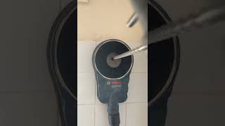 Core drilling through tile using an drill dust extractor