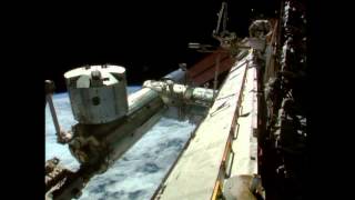 Spacewalkers Start Work On Commercial Docking Port To ISS | Video