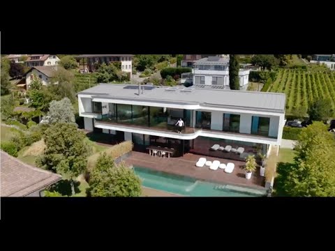 Vidéo: Villa scénique en Suisse par GD Architectes