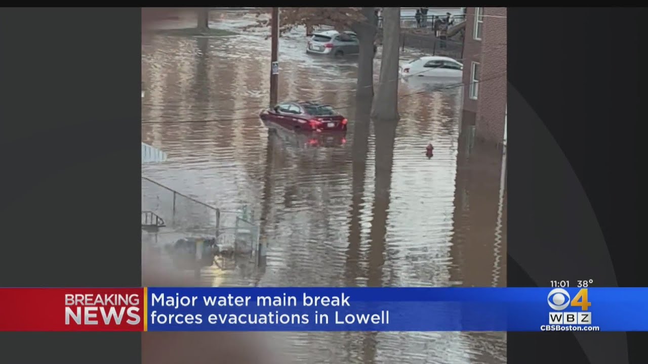 Dozens evacuated as water main break floods Lowell streets - YouTube
