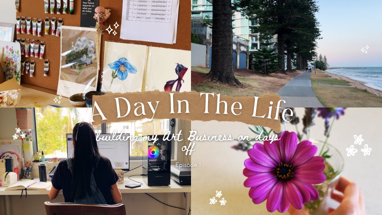 YouTube vlog thumbnail showing a day in the life of a watercolor artist and small business owner. The collage includes a studio workspace with floral paintings pinned to a board, watercolor supplies and sketchbooks on a desk, a woman working at her art table, a coastal beach walk lined with tall trees, and a close up of a pink daisy flower. Text overlay reads “A Day In The Life – Balancing Art & Small Business” with decorative floral accents and a YouTube play button.