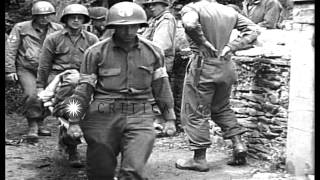 United States 35th Infantry Division soldiers enter St. Lo, France during World W...HD Stock Footage