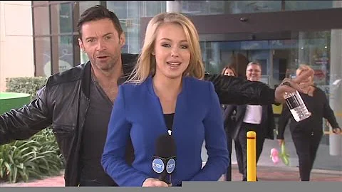 Hugh Jackman photobombs Ten News reporter Jessica ...