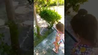 Alisa Is Watering The Trees