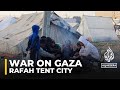 Rafah tent city: Thousands crowd makeshift camps in the south