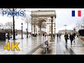 Walking after the rain in Avenue des Champs-Élysées, Paris, France