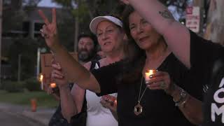 Locals hold candlelight vigil for victims of latest mass shootings