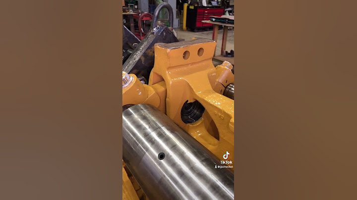 Cat D10T Track Frame work, pressing in Bogie Pins.
