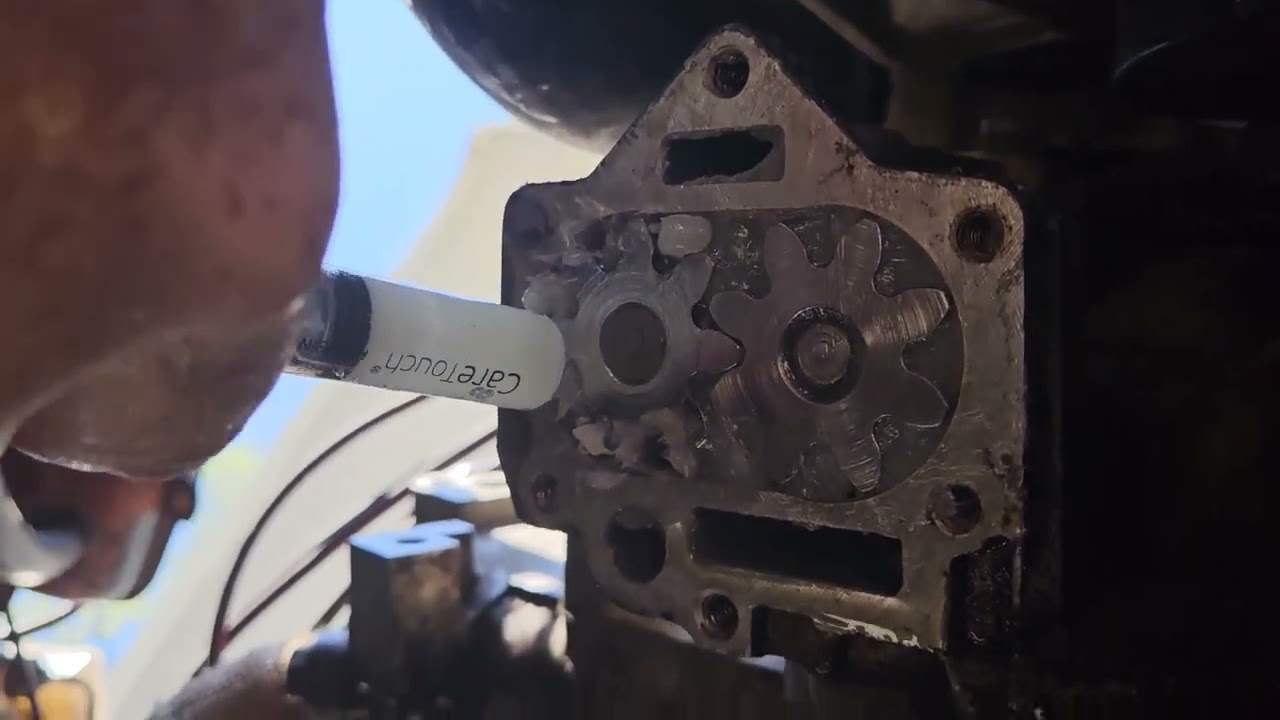 packing the gears in a Buick 215 Rover 3.5 L oil pump with Vaseline to prime them.