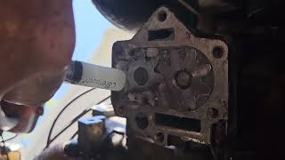 packing the gears in a Buick 215 Rover 3.5 L oil pump with Vaseline to prime them.