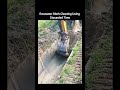 Excavator Ditch Cleaning Using Discarded Tires