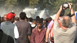 Tear Gas And Water Cannons Used On Migrants At Border