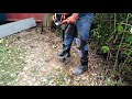 2 stroke auger digging a fence post hole