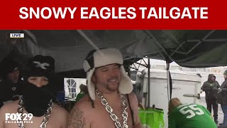 Eagles fans tailgate in bitter temps, several inches of snow