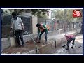 PWD Sprinkles Water On Delhi Roads To Reduce Dust Pollution