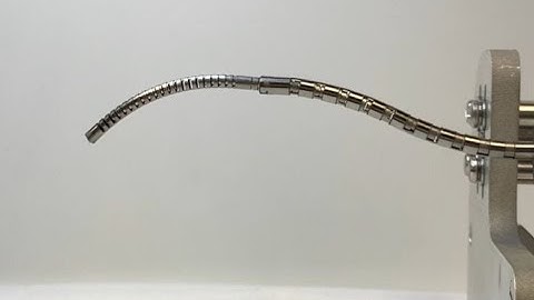 Concentric Push-Pull Robots: Slotted Tube Design
