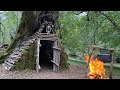 Building complete and warm bushcraft survival shelter in the trunk  bushcraft tree hut fireplace