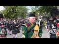 Massed Pipes  Drums parade through Deeside town to start the Ballater Highland Games 2018