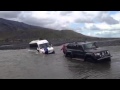 Van full of tourists stuck in river in Iceland