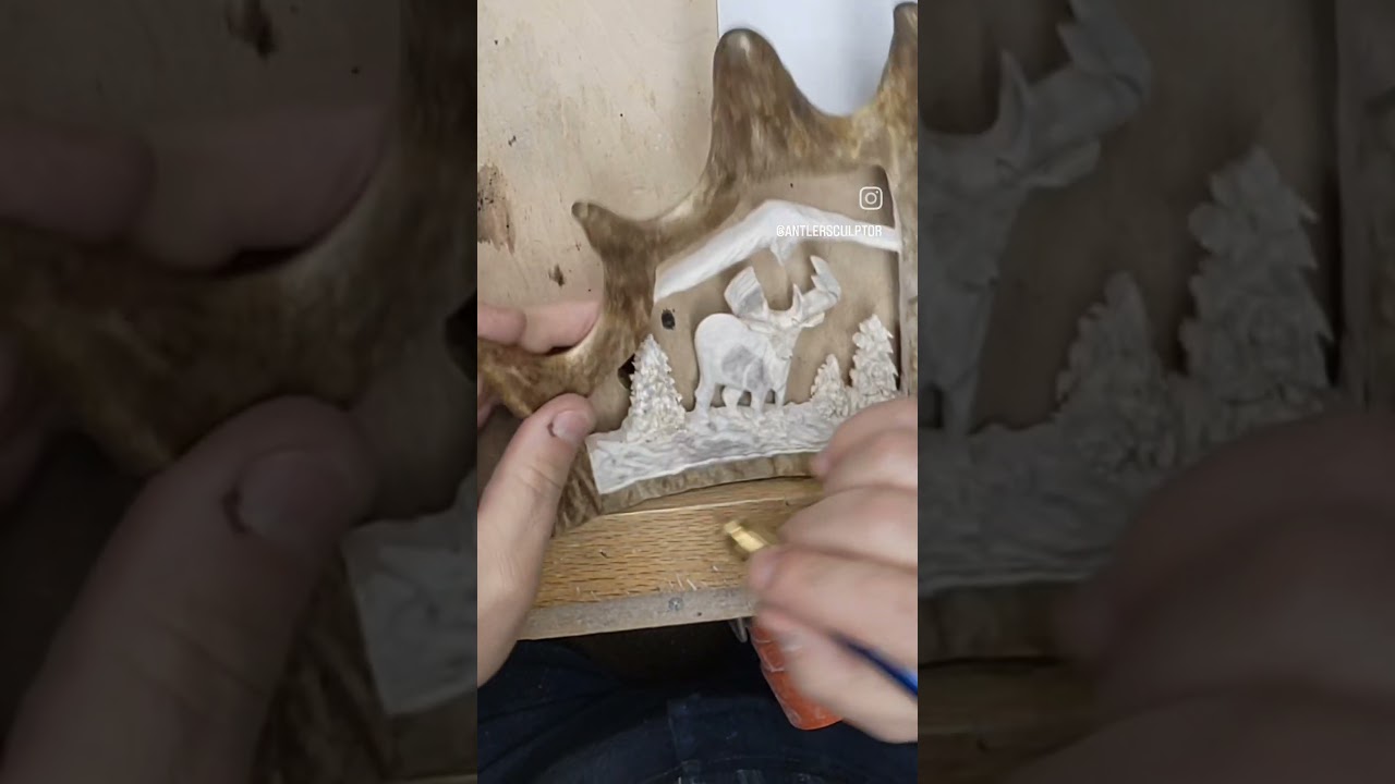 Carving "High Mountain Home" carved moose antler on olive wood base.