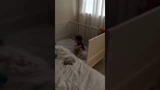 Boy falls into crib and hits his head on back of crib