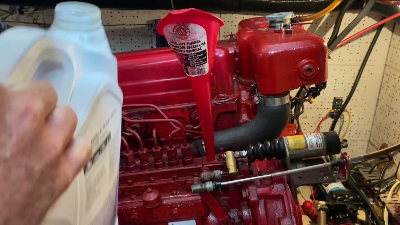 Grand Haven Engine Maintenance changing oil in our Ford Lehmans