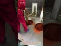 This image depicts a scene inside an automated chili powder production workshop.