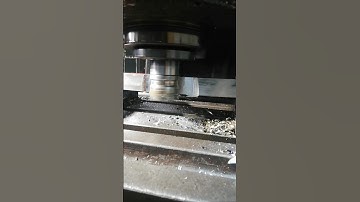 MILLING MACHINING FLAT TENSILE SAMPLE PRIOR TO PULL TEST IN METALLURGICAL TESTING LABORATORY