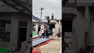Hoisting Heavy Steel: How Rural Workers Collaborate to Install a Large Beam