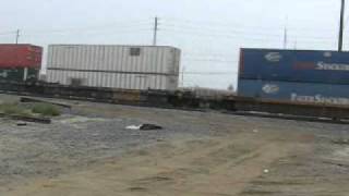 WB UPRR Auto Rack & EB UPRR Intermodal Trains Pass Each Other @ Colton CA.wmv