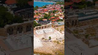 Vertical video. Side, Manavgat, Turkey. Aerial view of Apollo and Athena temples in bright sunlig...