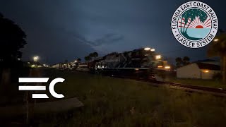 FEC 107 passing through downtown Titusville with FEC 510 hurricane Logo and 2414 ATIV Units 