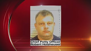 Navy chief behind bars