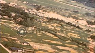 The US Army Air Force planes strafe the town of Tarumizo, Kyushu, Japan during Wo...HD Stock Footage