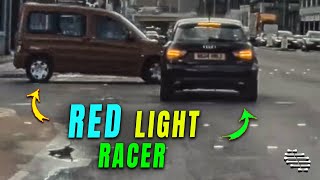 Driver Sets off through the Red Light Almost Causing a Collision