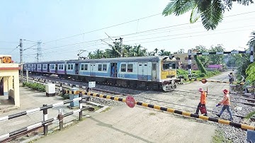 High speedy Accelerating EMU local train Moving Furiously Moveing out Railgate