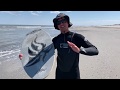 A beginner trying to catch waves on a skimboard