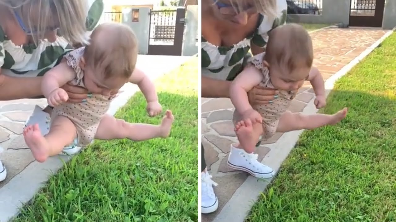 Baby girl refuses to let her feet touch the grass 