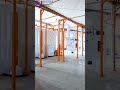Automatic powder painting line with two spray booths