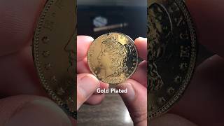 Gold plating doesn’t hide the peak sounds of the Silver Morgan Dollar inside