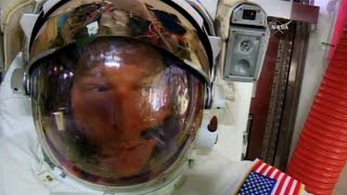 Astronaut's helmet takes on water during spacewalk