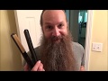 straightening a curly beard with a flat iron