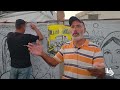 جهاد الشرافي يرسم على الخيمة ليوثق جوانب الحياة اليومية وتأثير الحرب على غزة