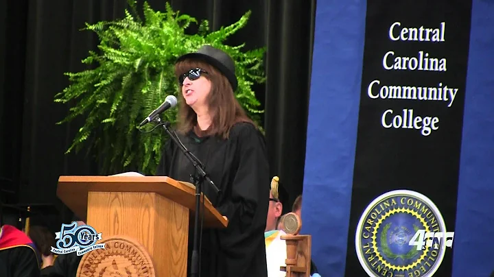 Commencment Speaker Ellen Bland sings the graduati...