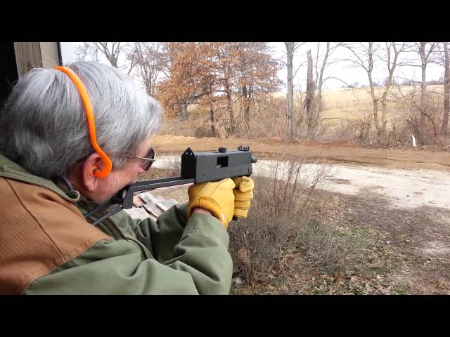 Dad shooting my MAC-10 full auto .45 cal class=