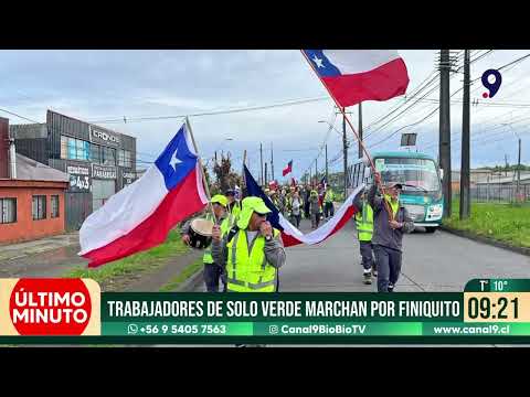 Workers in green uniforms march for severance pay