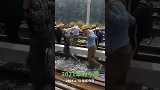Hardworking railway workers carrying concrete base to work