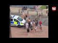 Teens surround police car and shout abuse at officers